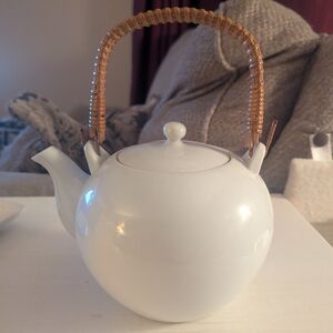 Elegant White Teapot with Wicker Handle